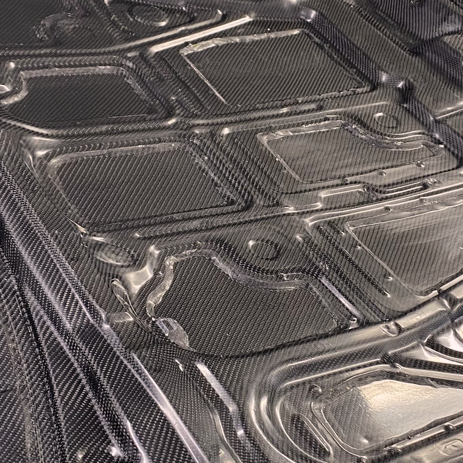 Close-up of lightweight carbon fibre bonnet developed for motorsport composite application