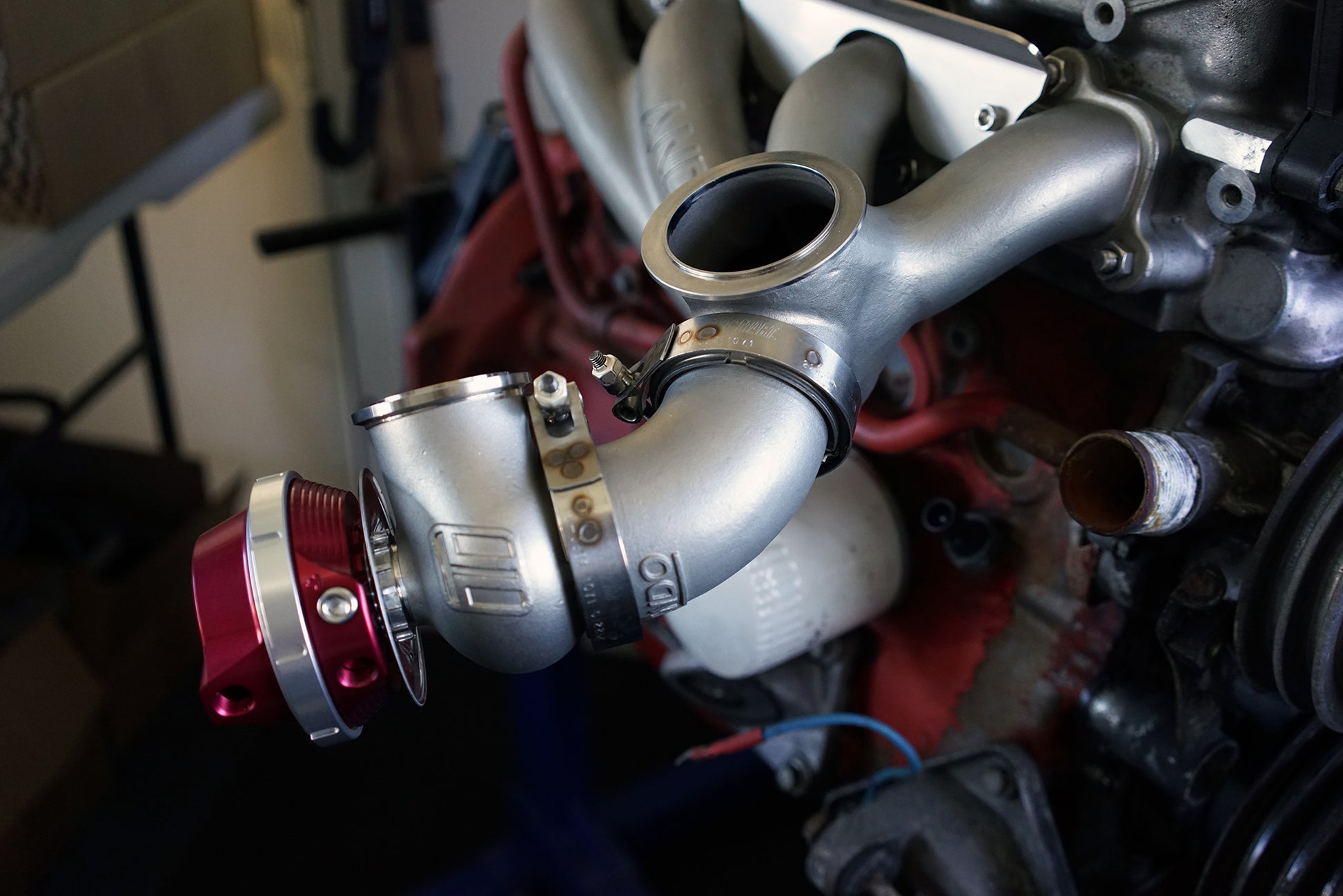 60-degree wastegate relocation elbow installed on turbo manifold with Turbosmart 45mm external wastegate
