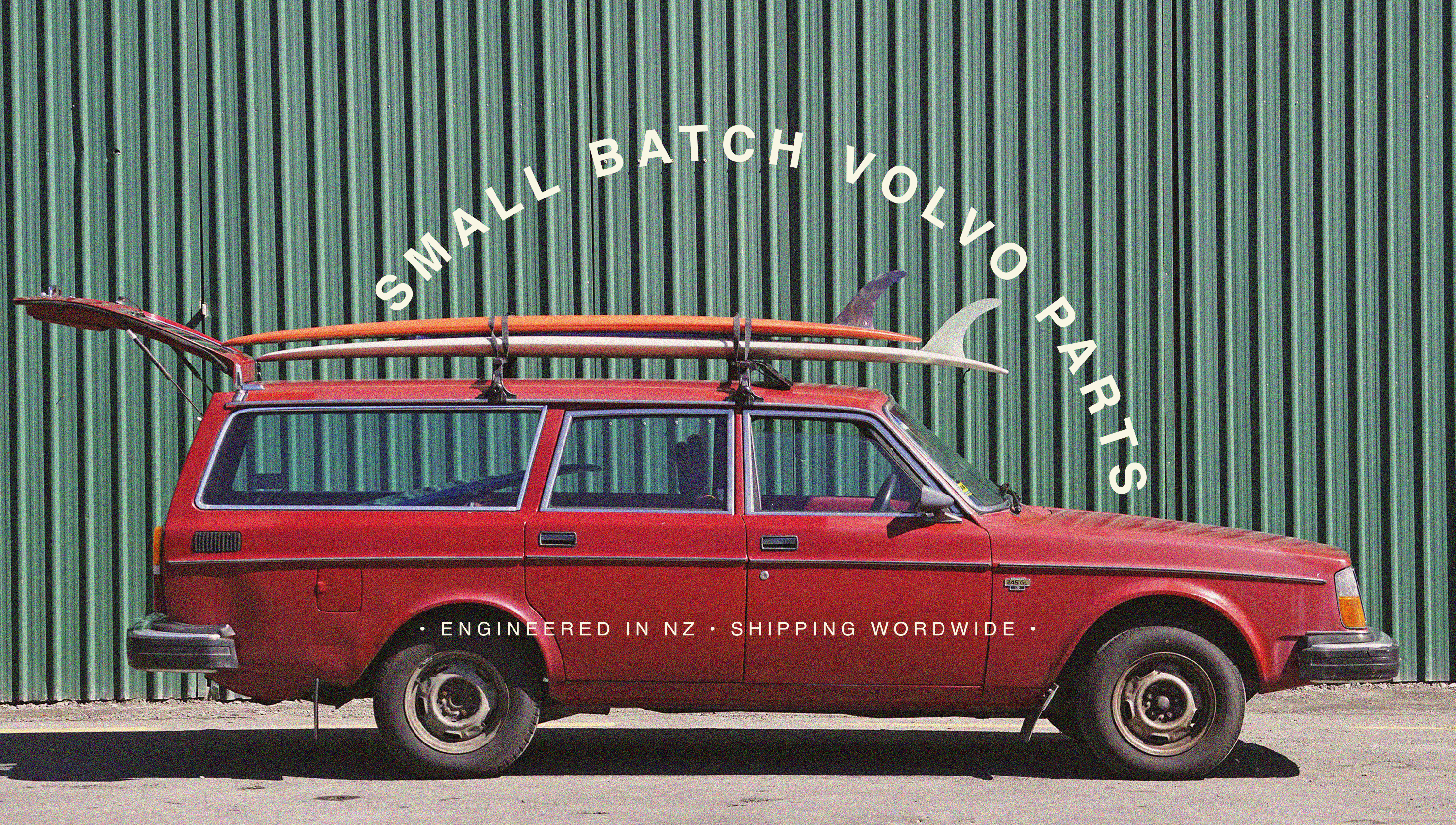 Red Volvo 245 wagon with surfboards; curved headline reads ‘Small-Batch Volvo Parts’ – Ando Engineering hero